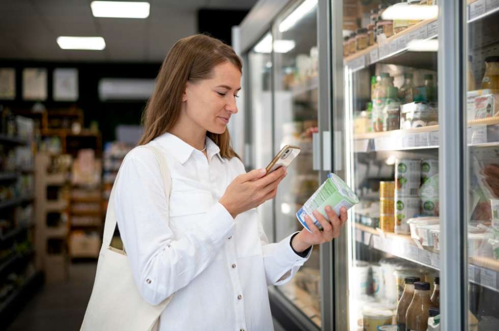 Woman scanning product in grocery store